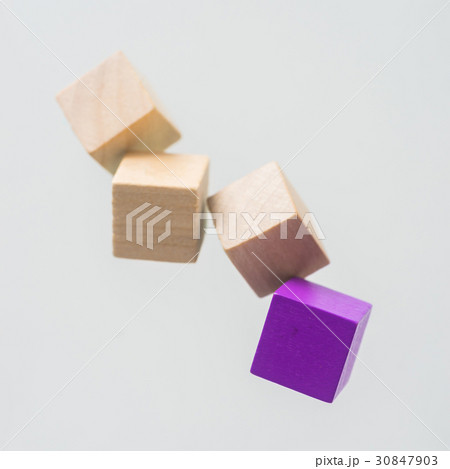 Floating wooden cube on grey background Floating wooden cube on grey background 30847903
