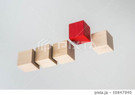float wood cube on grey background 30847940