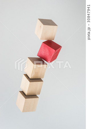 float wood cube on grey background 30847941