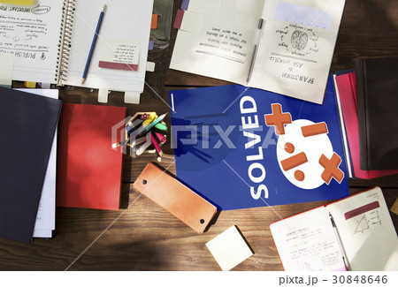 Aerial view of mathematics solution lessons on wooden table 30848646