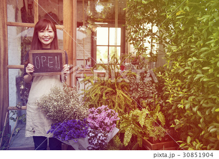 Young woman holding banner open the flower shop 30851904