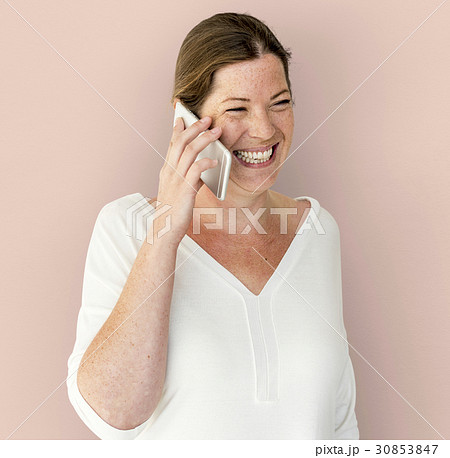 Caucasian Woman is Talking on the Phone Caucasian Woman is Talking on the Phone 30853847