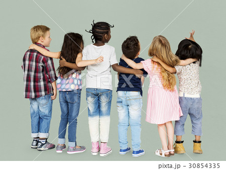 Group of children standing and huddle in rear view 30854335
