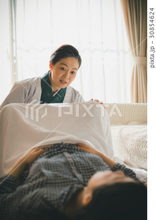 woman during pregnancy or shortly after childbirth 30854624