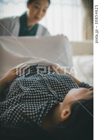 woman during pregnancy or shortly after childbirth 30854625