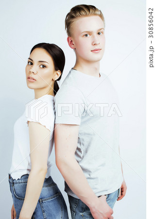young pretty teenage couple, hipster guy with his 30856042