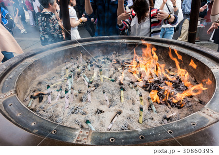 worshiping the shrine through incense in Sensoji worshiping the shrine through incense in Sensoji 30860395