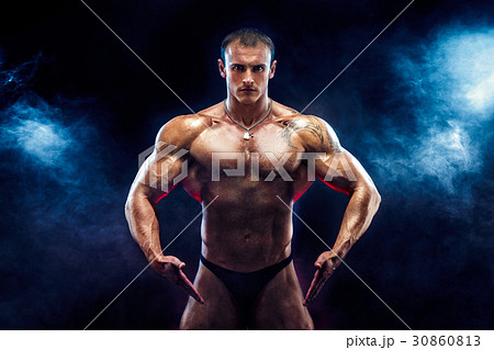 Strong bodybuilder man with perfect abs, shoulders,biceps, triceps, chest Strong bodybuilder man with perfect abs, shoulders,biceps, triceps, chest 30860813