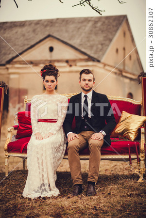 Romantic couple sitting on the couch 30862107