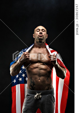 Handsome bald topless man with American flag  30863547