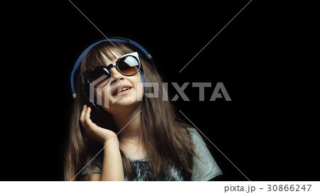 Young Cute Girl with Headphones and Sunglasses 30866247