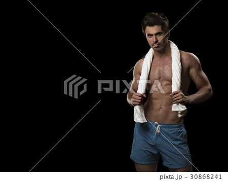 Muscular man posing with towel Muscular man posing with towel 30868241