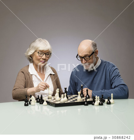 Elderly couple playing chess 30868242
