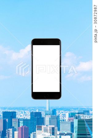 スマホ 携帯電話 スマートフォン 都市風景 東京 不動産イメージ スマホ 携帯電話 スマートフォン 都市風景 東京 不動産イメージ 30872987