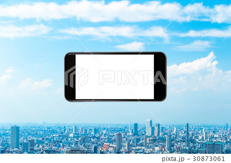 スマホ 携帯電話 スマートフォン 都市風景 東京 不動産イメージ スマホ 携帯電話 スマートフォン 都市風景 東京 不動産イメージ 30873061