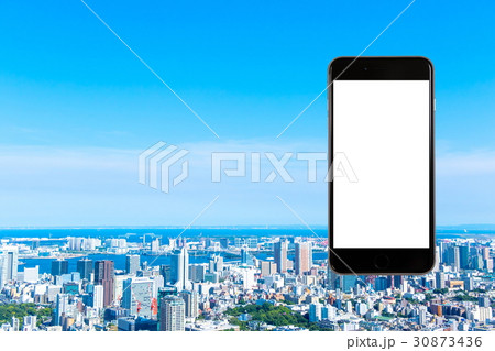 スマホ 携帯電話 スマートフォン 都市風景 東京 不動産イメージ スマホ 携帯電話 スマートフォン 都市風景 東京 不動産イメージ 30873436