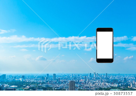 スマホ 携帯電話 スマートフォン 都市風景 東京 不動産イメージ スマホ 携帯電話 スマートフォン 都市風景 東京 不動産イメージ 30873557