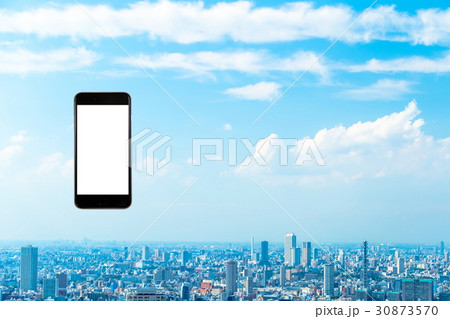 スマホ　携帯電話　スマートフォン　都市風景　東京　不動産イメージ 30873570