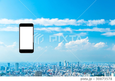 スマホ 携帯電話 スマートフォン 都市風景 東京 不動産イメージ スマホ 携帯電話 スマートフォン 都市風景 東京 不動産イメージ 30873578