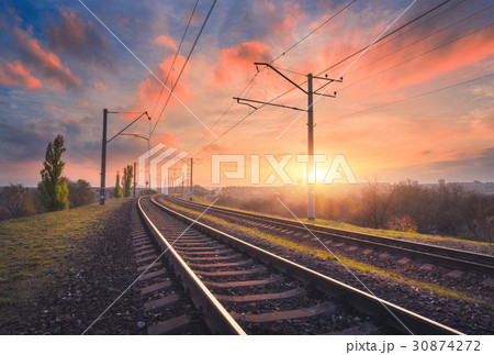 Railroad and beautiful sky at sunset Railroad and beautiful sky at sunset 30874272
