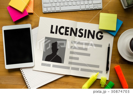 Patent License agreement LICENSING   man working o Patent License agreement LICENSING   man working o 30874703