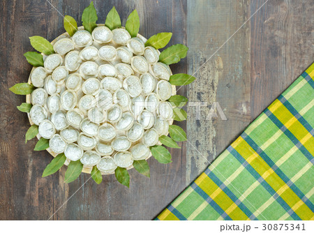 Meat dumpling srussian pelmeni wooden background Meat dumpling srussian pelmeni wooden background 30875341