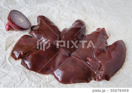 Raw chicken livers on paper Raw chicken livers on paper 30876409