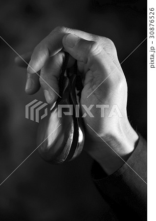 young man playing the castanets young man playing the castanets 30876526