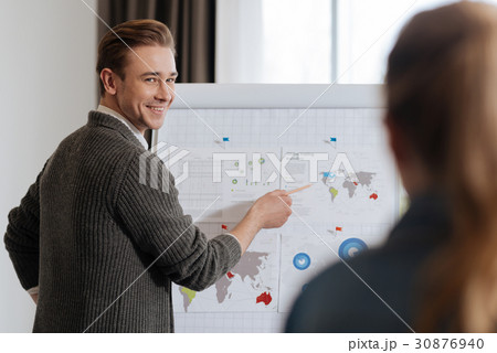 Joyful happy man pointing at the world map 30876940