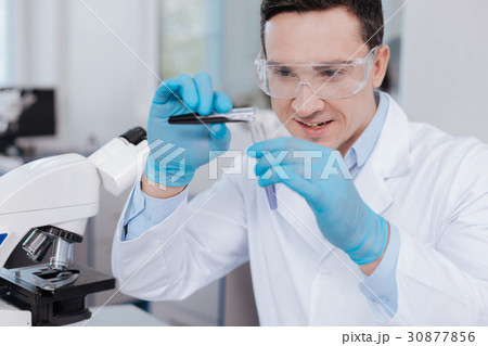 Positive delighted brunette doing experiment Positive delighted brunette doing experiment 30877856