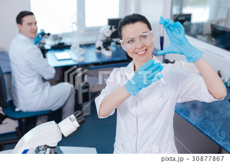 Attractive medical worker raising both hands Attractive medical worker raising both hands 30877867