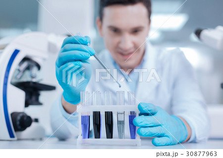Close up of support being filled with test glasses 30877963