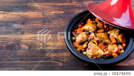Tagine with cooked chicken, vegetables. Copy space 30878600