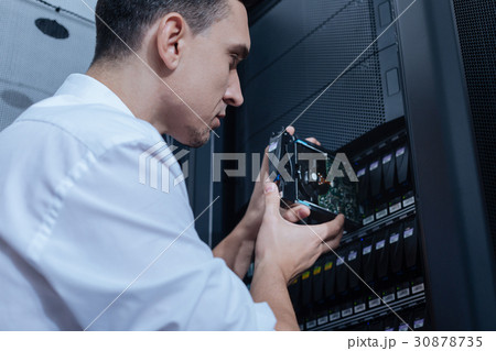 Handsome professional technician working with 30878735