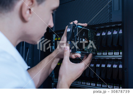 Modern hard drive being used for data storage 30878739