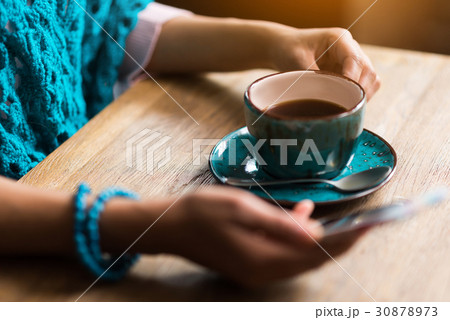 Cheerful girl messaging on smartphone during 30878973