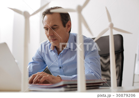 Professional engineer working on eco turbine Professional engineer working on eco turbine 30879206
