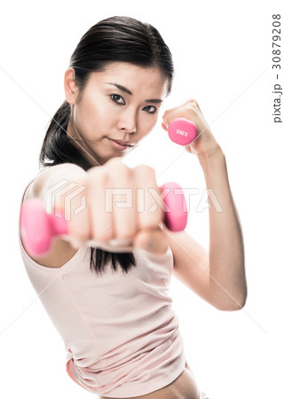 Young determined woman holding small dumbbells 30879208