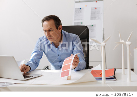 Concentrated man designing eco project 30879217