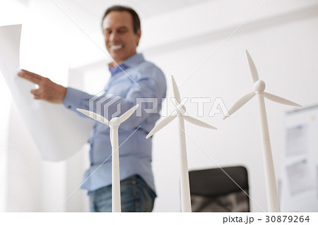 Cheerful professioanl engineeer involved in wind Cheerful professioanl engineeer involved in wind 30879264