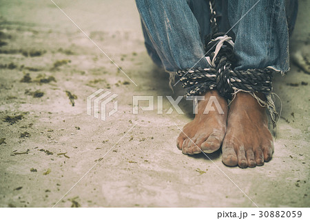 hopeless man feet tied together with rope hopeless man feet tied together with rope 30882059