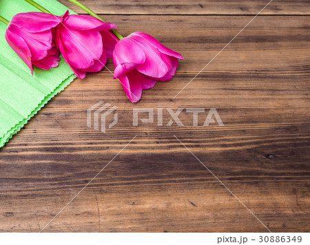 Pink tulips, floral arrangement on wooden Pink tulips, floral arrangement on wooden 30886349