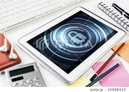 Web security and technology concept with tablet pc on wooden tab 30888434