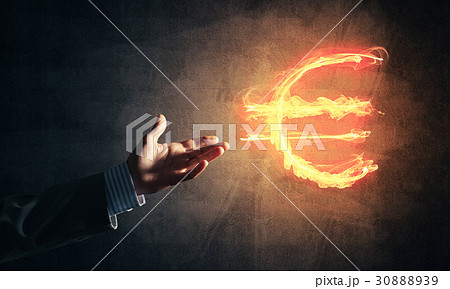 Concept of money making with euro currency fire symbol on dark b Concept of money making with euro currency fire symbol on dark b 30888939