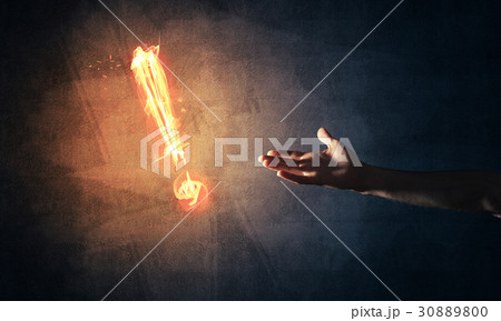 Concept of attention or punctuation with burning exclamation mark on dark background Concept of attention or punctuation with burning exclamation mark on dark background 30889800