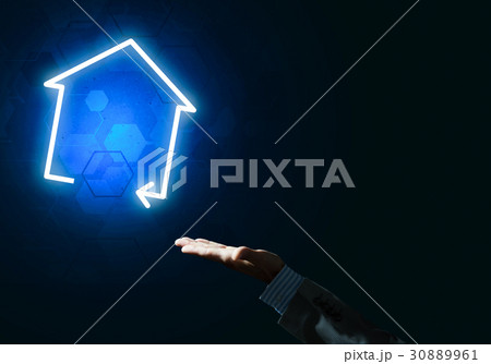 Conceptual image with hand pointing at house or main page icon o Conceptual image with hand pointing at house or main page icon o 30889961