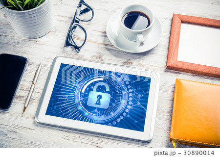 Web security and technology concept with tablet pc on wooden table 30890014