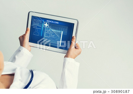 Close of female doctor hands working with tablet pc computer 30890187