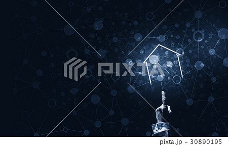 Conceptual image with hand pointing at house or main page icon on dark background 30890195