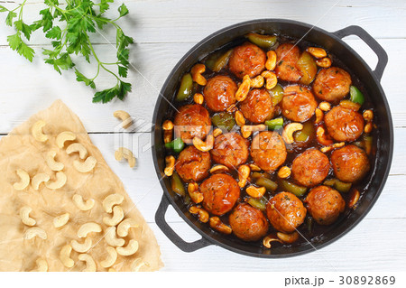 Chinese Cashew Chicken meatballs in saucepan Chinese Cashew Chicken meatballs in saucepan 30892869